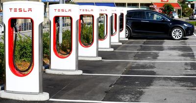 Tesla car stands at a charging station in Melide, Switzerland. Reuters