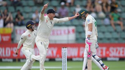 England fielder Ollie Pope, left, celebrates with Ben Stokes after catching out Faf du Plessis off the bowling of Dom Bess. Getty