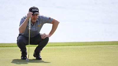 Scotland's Stephen Gallacher lines-up a putt on the 9th green on his way to an opening round 62 that left in second place on the leaderboard. Getty