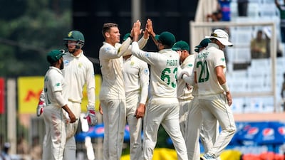 South Africa's George Linde celebrates with teammates after dismissing India batsman Ajinkya Rahane. AFP