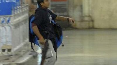 Mohammad Ajmal Kasab, the lone surviving gunman of the 2008 Mumbai attacks, walks on the premises of the Chhatrapati Shivaji Terminus or Victoria Terminus railway station in Mumbai, November 26, 2008.