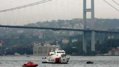 Turkish coast guard boats patrol next to the Bosphorus Bridge in Istanbul.