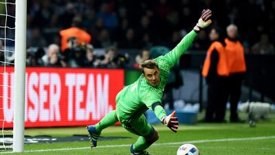 German goalie Manuel Neuer concedes a goal by England’s Harry Kane (not pictured) during the international friendly soccer match between Germany and England in Berlin, Germany, 26 March 2016. EPA/SOEREN STACHE