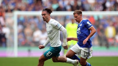 Manchester City's Jack Grealish in action with Leicester City's Marc Albrighton.