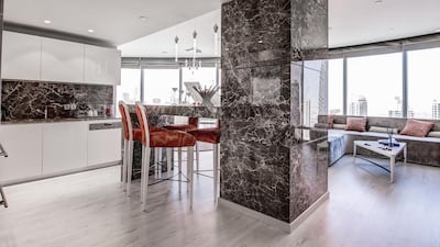 The kitchen and dining area of the apartment in the Burj Khalifa. Courtesy of Luxhabitat