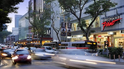 Traffic at Orchard Road during evening rush hour in Singapore. The country aims to phase out combustion car sales by 2030. Bloomberg