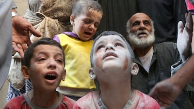 Syrian boys cry following Russian air strikes on the rebel-held Fardous neighbourhood of Aleppo on October 11, 2016. Thaer Mohammed/AFP