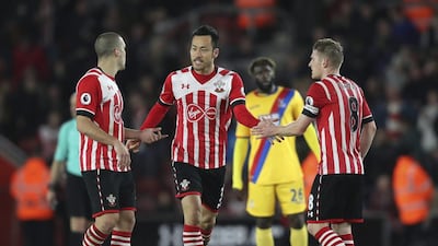 Southampton's Maya Yoshida, centre, celebrates scoring his side's second goal against Crystal Palace. Southampton won 3-1. Andrew Matthews / AP