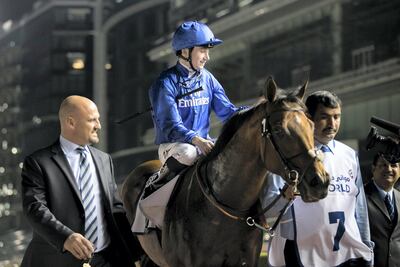 Oisin Murphy aboard Benbatl celebrates their Al Rashidiya win on Thursday night. Reem Mohammed / The National