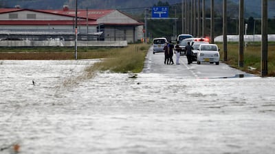 A submerged road in Saito, Japan. Nanmadol brought much of the country's transport to a standstill. AP