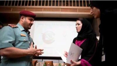 Lt Col Faisal Mohammed Al Shamari, director of the Ministry of Interior Child Protection Centre, talks with Samia Kazi, chief operating officer of Arabian Child, second right, at the forum in Dubai on Saturday.
