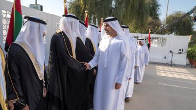 Sheikh Omar bin Zayed, Deputy Chairman of the Board of Trustees of Zayed bin Sultan Al Nahyan Charitable and Humanitarian Foundation, right greets fellow wedding attendees. Mohamed Al Raeesi for Crown Prince Court - Abu Dhabi