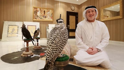 The falconer and Nabadi poet Salem Al Dhabari at home in Abu Dhabi with his hunting falcons. Ravindranath K / The National