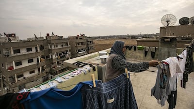 "This is the monster," Shara Sido alleged, showing a photograph of the Syrian fighter she said confessed to shooting dead her 38-year-old son. AFP