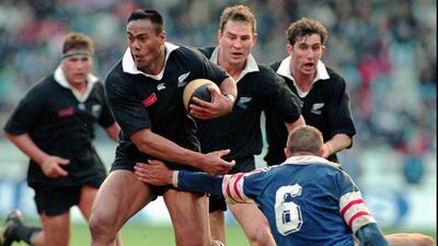 Jonah Lomu, breaks the tackle of France’s Philippe Benetton right, during their rugby test match at Parc des Princes stadium in Paris. Lionel Cironneau / AP Photo