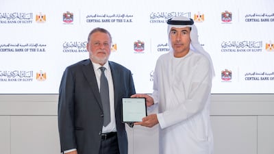 UAE Central Bank governor Khaled Balama, right, with Central Bank of Egypt governor Hassan Abdalla during the signing of the agreement. Photo: CBUAE