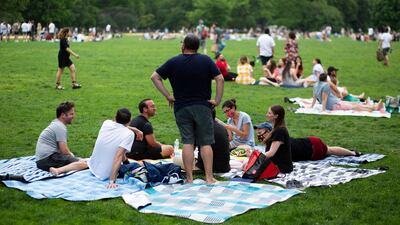 People gather in Central Park in New York. After 16 months of safety measures in place owing to the pandemic, New Yorkers can now enjoy a city in which most restrictions have been lifted. AFP