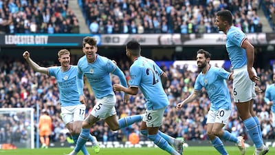 Manchester City's John Stones, second left, celebrates scoring the opening goal. PA