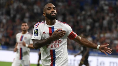 Lyon's French forward Alexandre Lacazette celebrates after scoring his team's second goal from the penalty spot. AFP