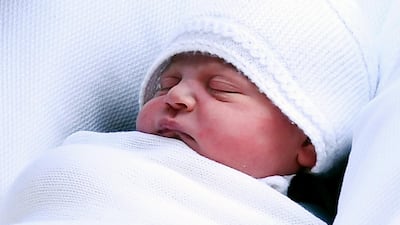 Britain's Prince William, Duke of Cambridge carries his newborn son,Louis Arthur Charles, as they leave the Lindo Wing at St Mary's Hospital in London. Andy Rain / EPA