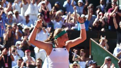 Latvia's Jelena Ostapenko celebrates after winning her French Open final against Romania's Simona Halep at Roland Garros on Saturday. Francois Xavier Marit / AFP