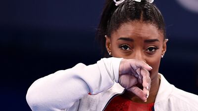 USA's Simone Biles gestures during the artistic gymnastics women's team final during the Tokyo 2020 Olympic Games at the Ariake Gymnastics Centre in Tokyo on July 27, 2021. Biles withdrew from another Olympic final on Sunday.