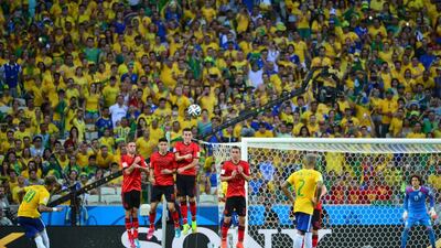 Brazil forward Neymar kicks the ball from a set piece during his side's 2014 World Cup Group A match on Tuesday against Mexico. Yuri Cortez / AFP