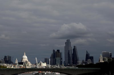 St Paul's Cathedral is seen together with skyscrapers in the City of London. The financial district faces an anxious wait to learn on what basis it can continue dealing with Europe in the future as the landmark trade deal did not cover the country's finance sector. Reuters