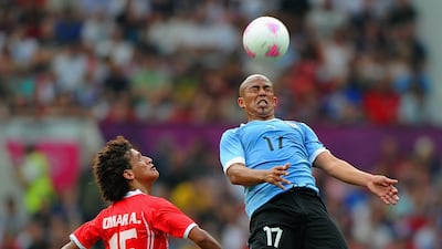 Omar Abdulrahman of the UAE in action with Uruguay's Egidio Arevalo. Getty Images