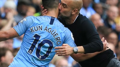 Manchester City manager Pep Guardiola kisses Sergio Aguero as the Argentine is substituted just after completing his hat-trick during the Premier League match at home to Huddersfield Town in August, 2019. Reuters