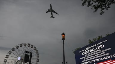 Air Force One flies over the Great American State Fair on the National Mall, Washington. Getty Images via AFP