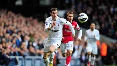 Gareth Bale, left, scored his 16th league goal of the season against Arsenal yesterday. Glyn Kirk / AFP