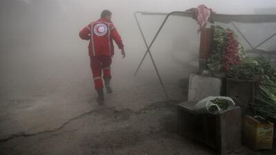 The Syrian Arab Red Crescent searches for victims following a reported government airstrike on the rebel-held town of Douma, Syria, on the eastern outskirts of the capital Damascus, on November 10, 2016. At least 11 people were killed in the air strikes, according to the Syrian Observatory for Human Rights. Abd Doumany / Agence France-Presse