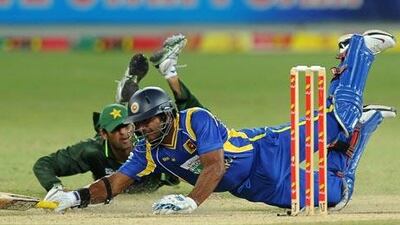 Sri Lanka’s Kumar Sangakkara, right, is run out on 45 against Pakistan in Dubai last night.