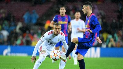Benfica's Brazilian forward Everton fights for the ball with Barcelona's Austrian forward Yusuf Demir. AFP