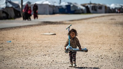 A child at Camp Roj, in north-east Syria, where relatives suspected ISIS members are held. Some 24 million Syrians, at home and abroad, depend on handouts. AFP