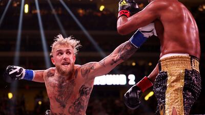 Jake Paul punches Anderson Silva during their cruiserweight bout at Gila River Arena in Glendale, Arizona. AFP