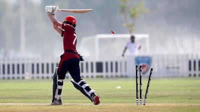 Harrison Carlyon of Jersey bowled out by Waheed Ahmed during the World Cup T20 Qualifiers between UAE vs Jersey held at the Tolerance Oval cricket ground in Abu Dhabi. Pawan Singh / The National