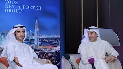 Mohamed Alabbar, right, and son Rashid share details of the Yoox Net-a-Porter deal. Victor Besa for The National