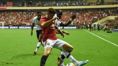 United's Daniel James (front) fights for the ball with Tottenham's Moussa Sissoko. AFP
