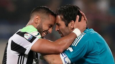 Juventus defender edhi Benatia, left, celebrates with goalkeeper Gianluigi Buffon after beating AC Milan in the Coppa Italia final at the Stadio Olimpico. Isabella Bonotto / AFP