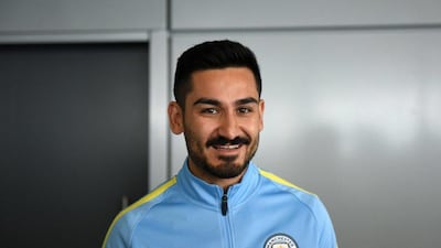 Manchester City’s German midfielder Ilkay Gundogan arrives to meet members of the media at the City Football Academy in Manchester, north west England on July 3, 2016. Oli Scarff / AFP
