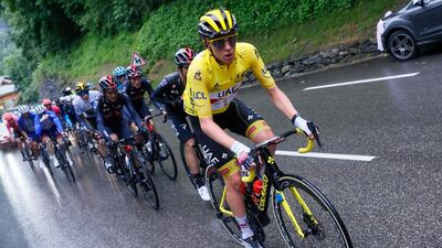UAE Team Emirates' Tadej Pogacar, wearing the overall leader's yellow jersey, leads the pack during Stage 9 of the Tour de France. AFP