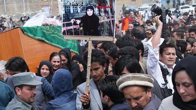 Afghan women carry the coffin of Farkhunda through downtown Kabul, Afghanistan on March 2015, during her burial ceremony. An Afghan court has overturned the death sentences for four men convicted of taking part in the mob killing outside a Kabul shrine. Massoud Hossaini / Associated Press