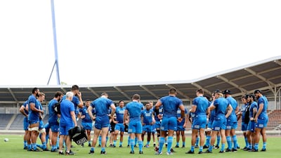 The All Blacks gather for a team talk during training at Kashiwanoha Stadium.Getty