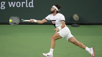 Nikoloz Basilashvili of Georgia hits a return to Cameron Norrie of Great Britain. EPA