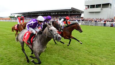 Capri ridden by Seamie Heffernan, in front, before winning the Dubai Duty Free Irish Derby at Curragh Racecourse. Press Association