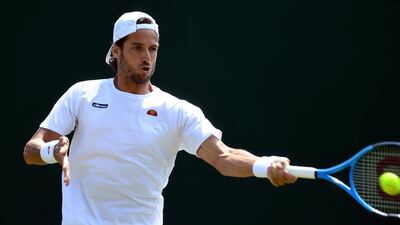 Feliciano Lopez broke Roger Federer's record for most consecutive appearances at a grand slam as he triumphed in the first round at Wimbledon. Gerry Penny / EPA