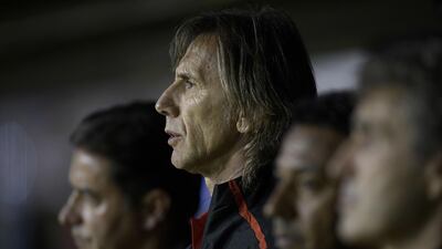 Ricardo Gareca, centre, could be on the verge of guiding Peru to the 2018 World Cup finals. Juan Mabromata / AFP