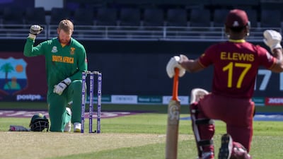 South Africa's Heinrich Klaasen, left, and West Indies' Evin Lewis take a knee prior to the start of the match. AP